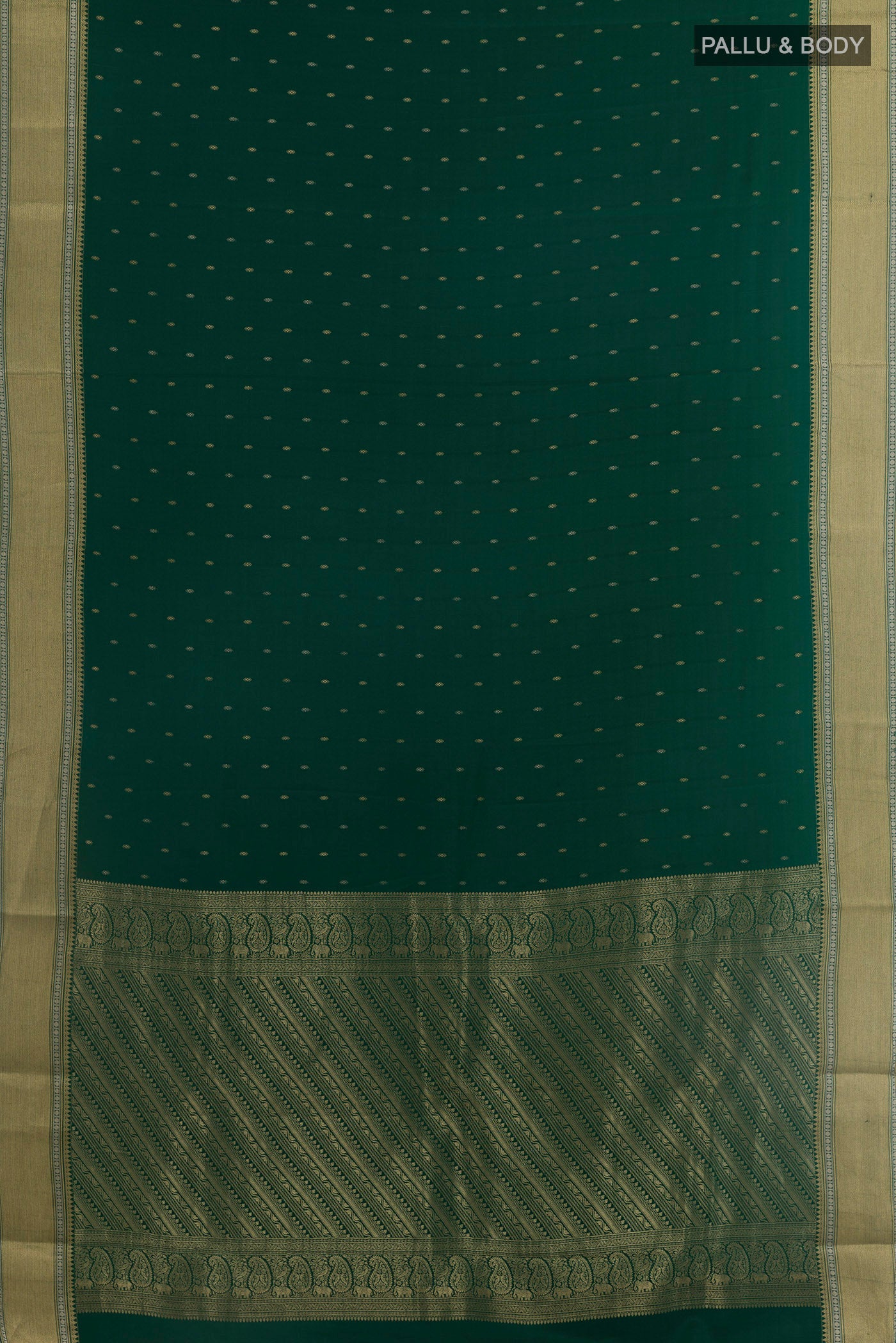 Flat view of Bottle Green Mysore Crepe Saree with Zari Butta on the body and Zari Border. 