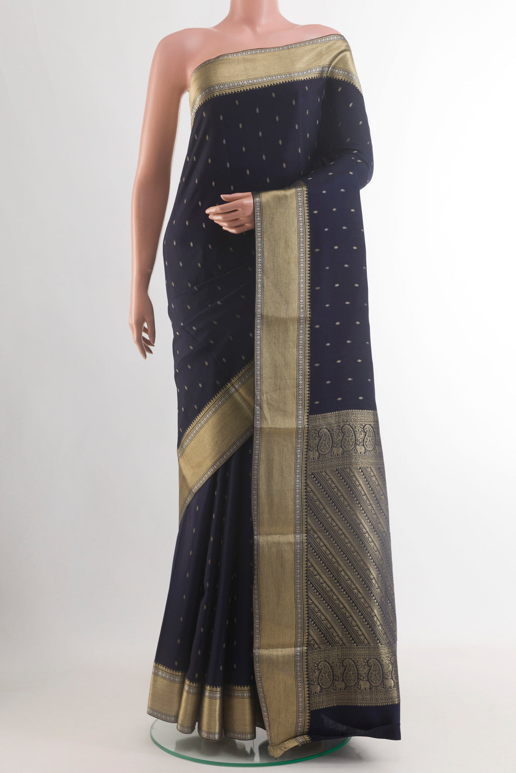 Navy Blue Mysore Crepe Saree with Zari Butta on the body and Zari Border.  displayed on a mannequin