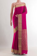 Rani Pink Mysore Crepe Saree with Zari Butta on the body and Zari Border.  displayed on a mannequin