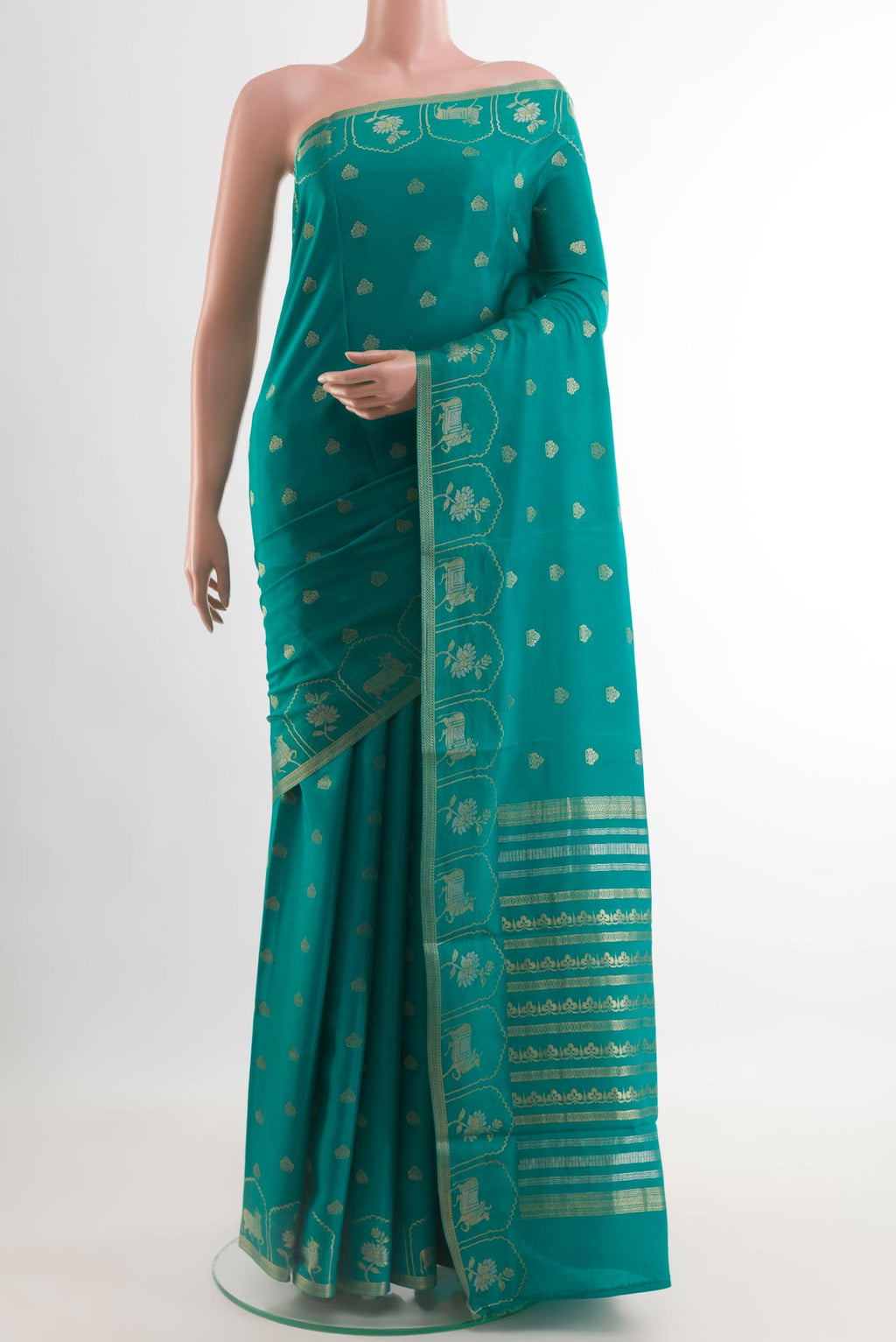 Sea Green Mysore Crepe Saree with Zari Butta on the body and Zari Border.  displayed on a mannequin