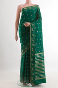 Green Mysore Crepe Saree with Zari Butta on the body and Zari Border.  displayed on a mannequin