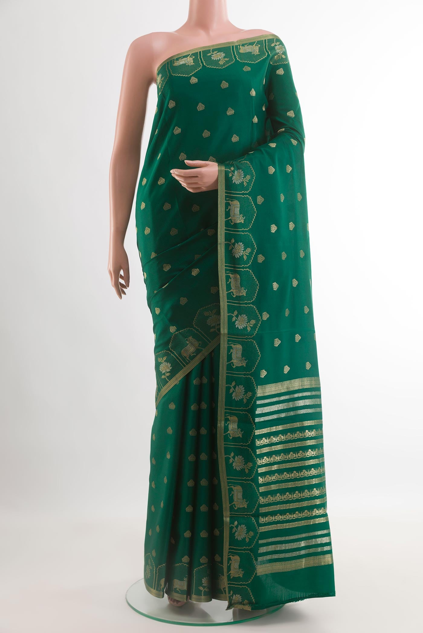 Green Mysore Crepe Saree with Zari Butta on the body and Zari Border.  displayed on a mannequin