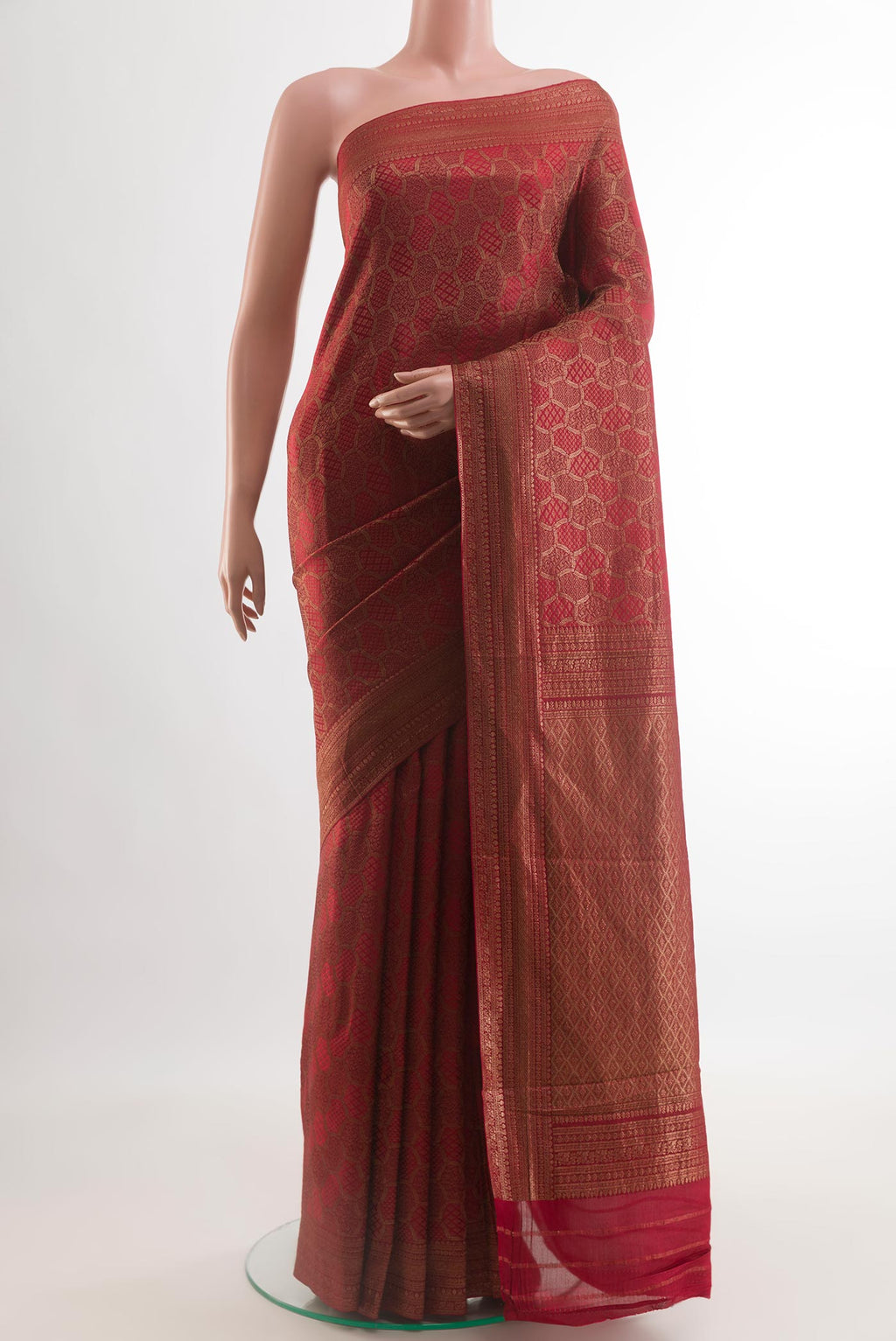 Maroon Mysore Crepe Saree with Zari Brocade on the body and Zari Border.  displayed on a mannequin