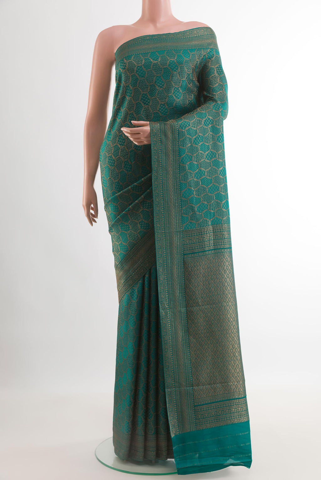 Teal Mysore Crepe Saree with Zari Brocade on the body and Zari Border.  displayed on a mannequin