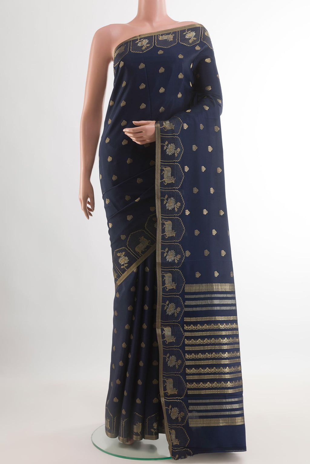 Navy Blue Mysore Crepe Saree with Zari Butta on the body and Zari Border.  displayed on a mannequin