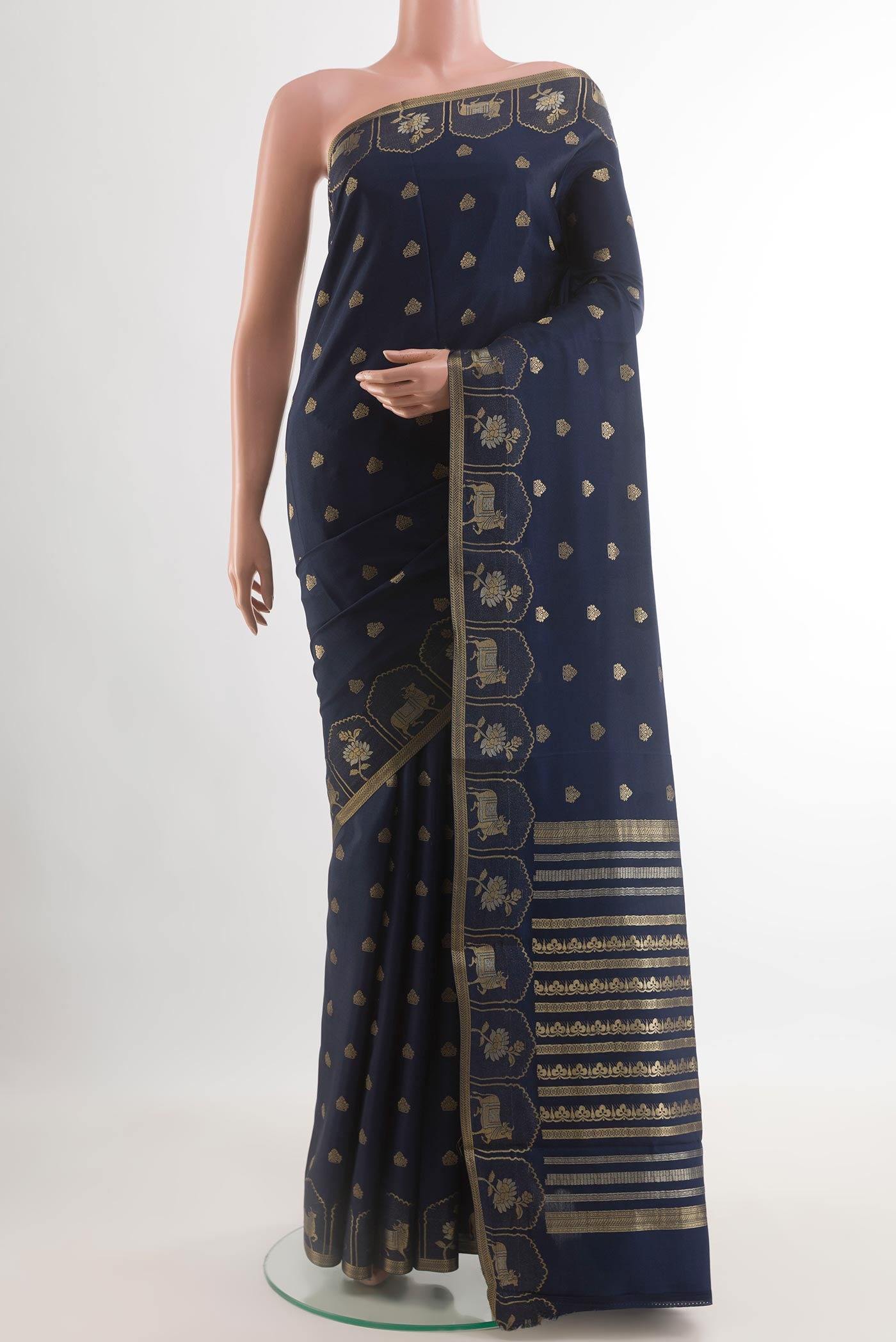 Navy Blue Mysore Crepe Saree with Zari Butta on the body and Zari Border.  displayed on a mannequin