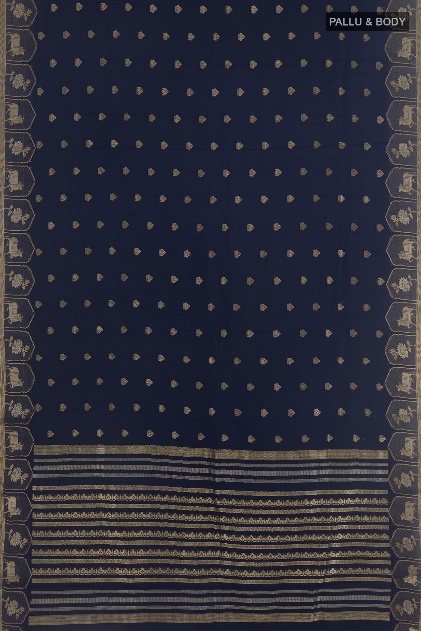 Flat view of Navy Blue Mysore Crepe Saree with Zari Butta on the body and Zari Border. 