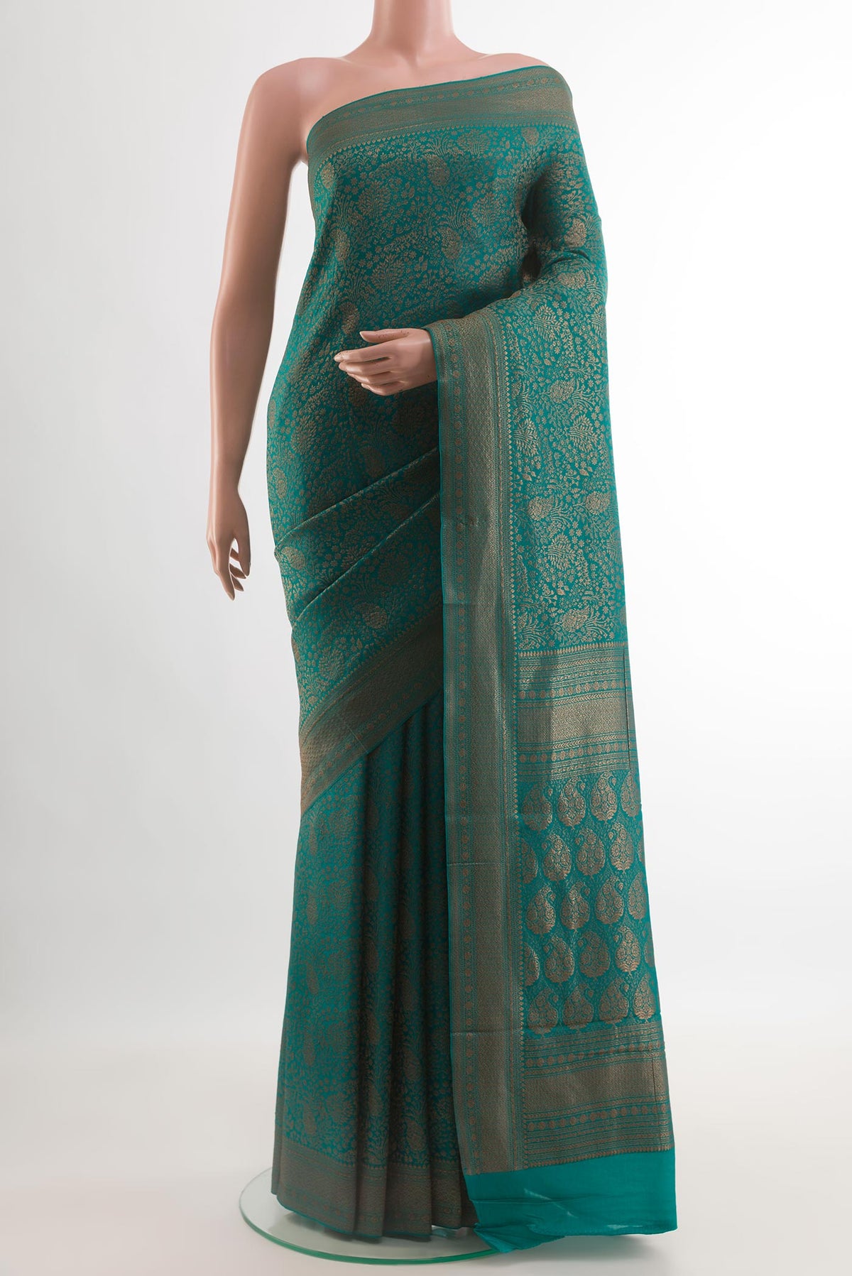 Teal Mysore Crepe Saree with Zari Brocade on the body and Zari Border.  displayed on a mannequin