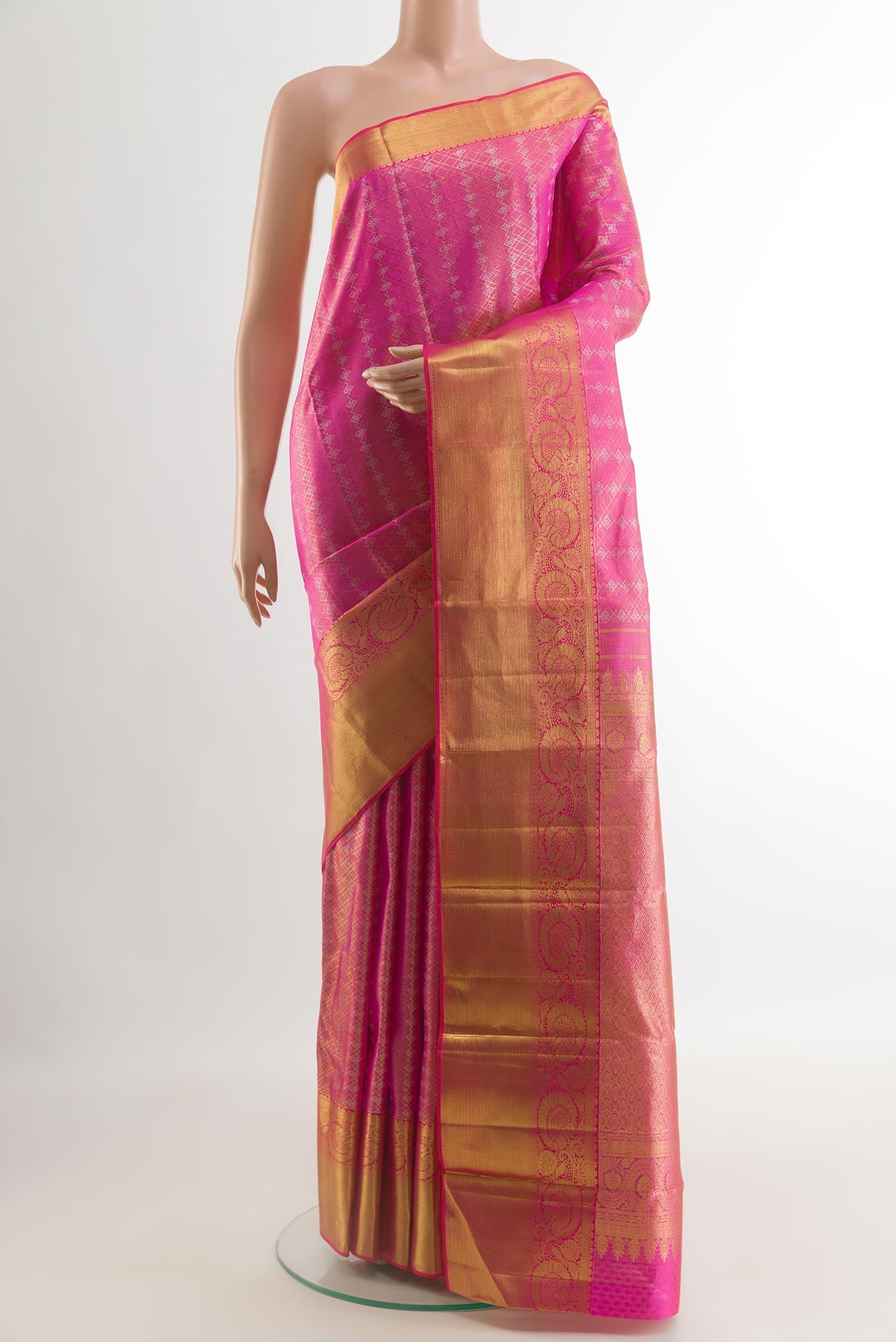 Pink Kanjivaram Silk Saree with Zari Butta on the body and Zari Border.  displayed on a mannequin