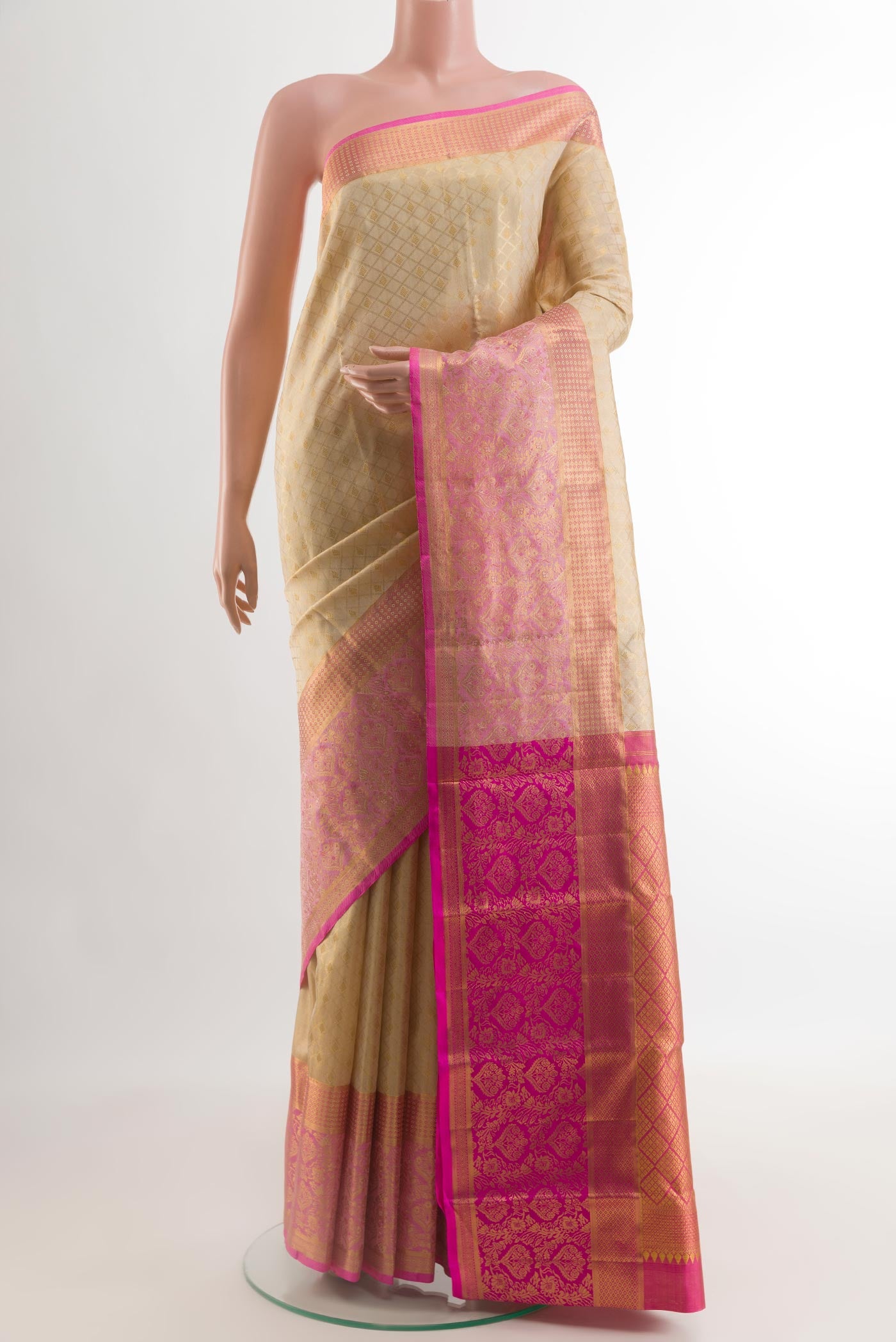 Cream Kanjivaram Silk Saree with Zari Brocade on the body and Zari Border.  displayed on a mannequin