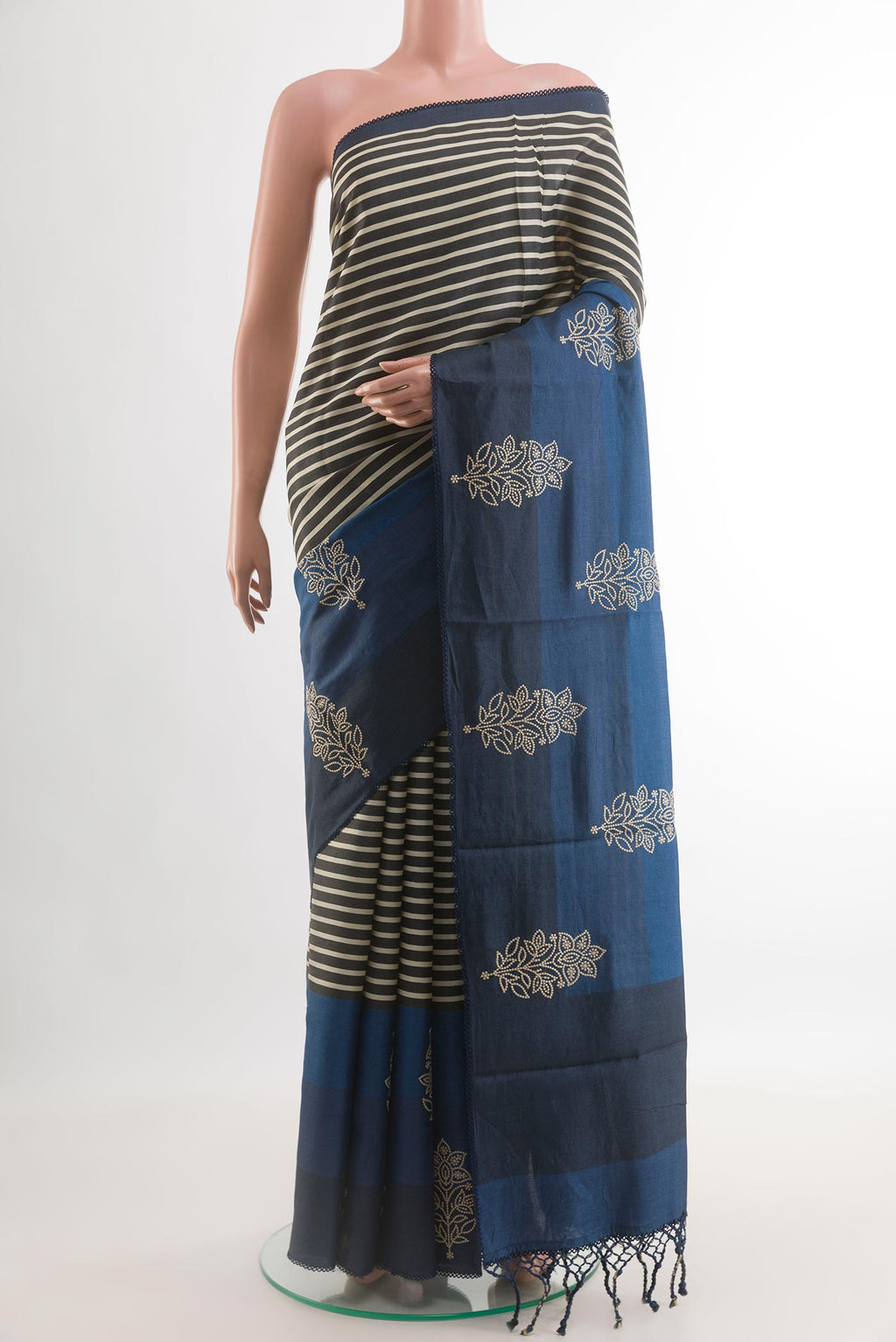 Blue Tussar Saree with Stripes on the body and Embroidery Border.  displayed on a mannequin