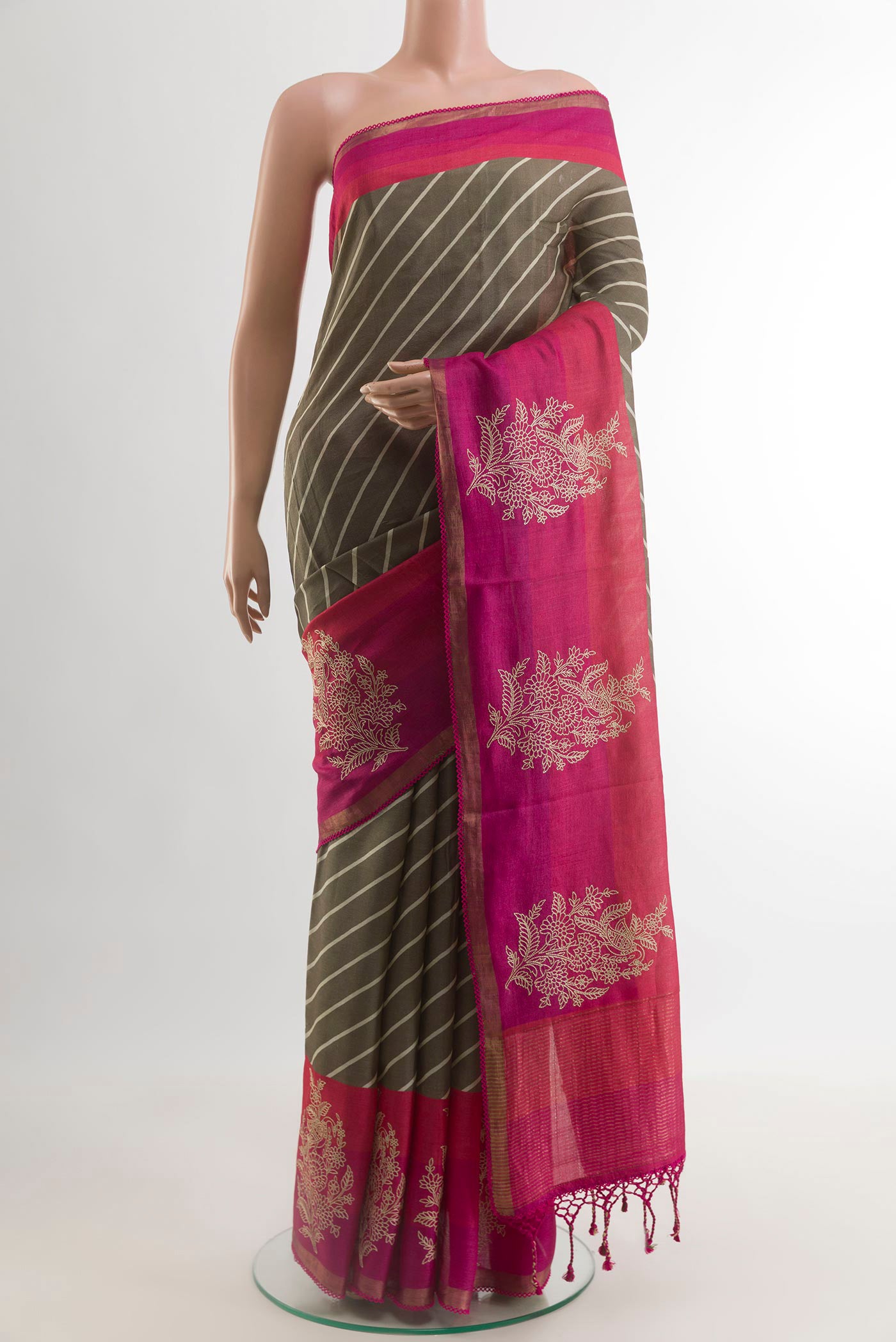 Brown Tussar Silk Saree with Printed design on the body and Plain Border.  displayed on a mannequin