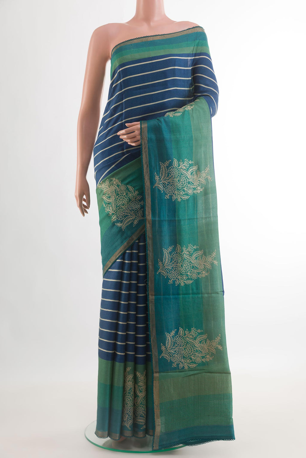 Blue Tussar Saree with Stripes on the body and Embroidery Border.  displayed on a mannequin