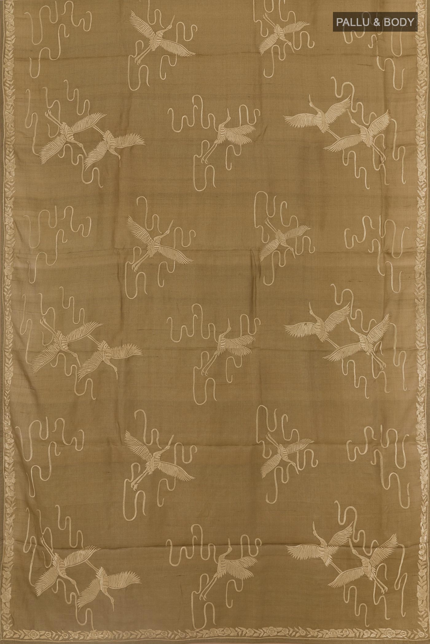 Flat view of Beige Tussar Silk Saree with Embroidery on the body and Embroidery Border. 