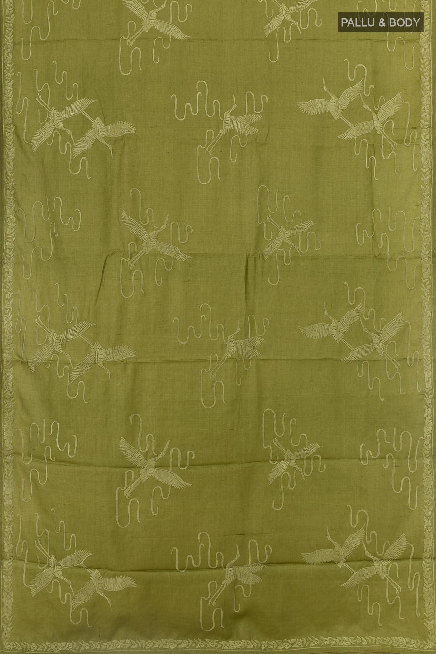 Flat view of Green Tussar Silk Saree with Embroidery on the body and Embroidery Border. 
