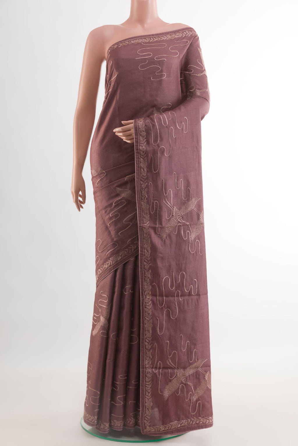 Purple Tussar Silk Saree with Embroidery on the body and Embroidery Border.  displayed on a mannequin
