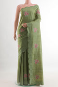 Sage Green Tussar Silk Saree with Embroidery on the body and Embroidery Border.  displayed on a mannequin