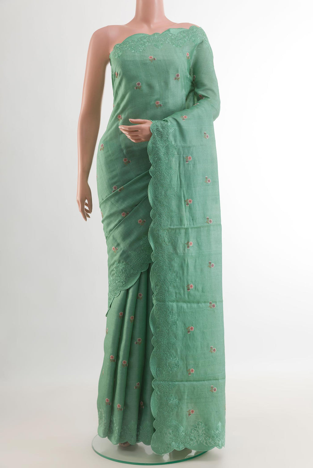 Sea Green Tussar Silk Saree with Embroidery on the body and Embroidery Border.  displayed on a mannequin