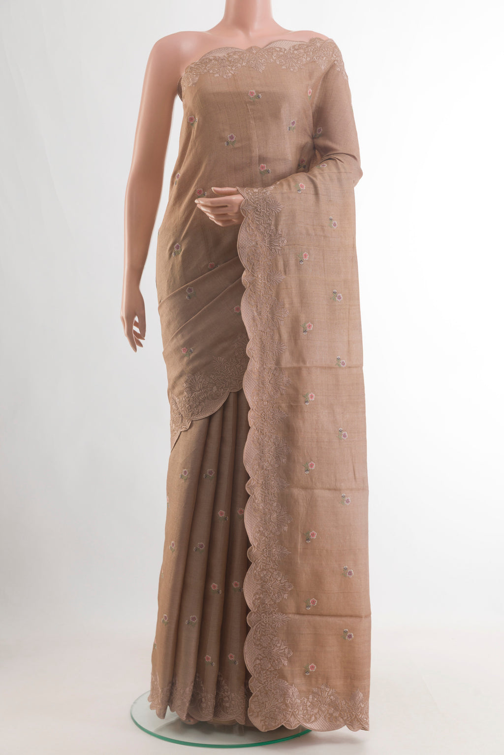 Beige Tussar Saree with Embroidery on the body and Embroidery Border.  displayed on a mannequin