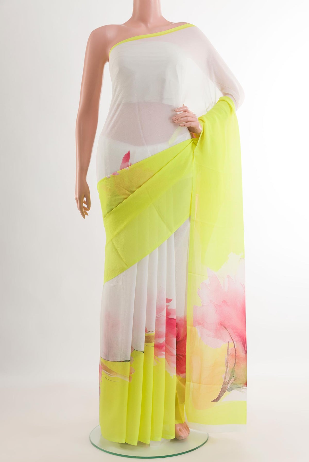 Yellow Chiffon Saree with Printed design on the body and Zari Border.  displayed on a mannequin