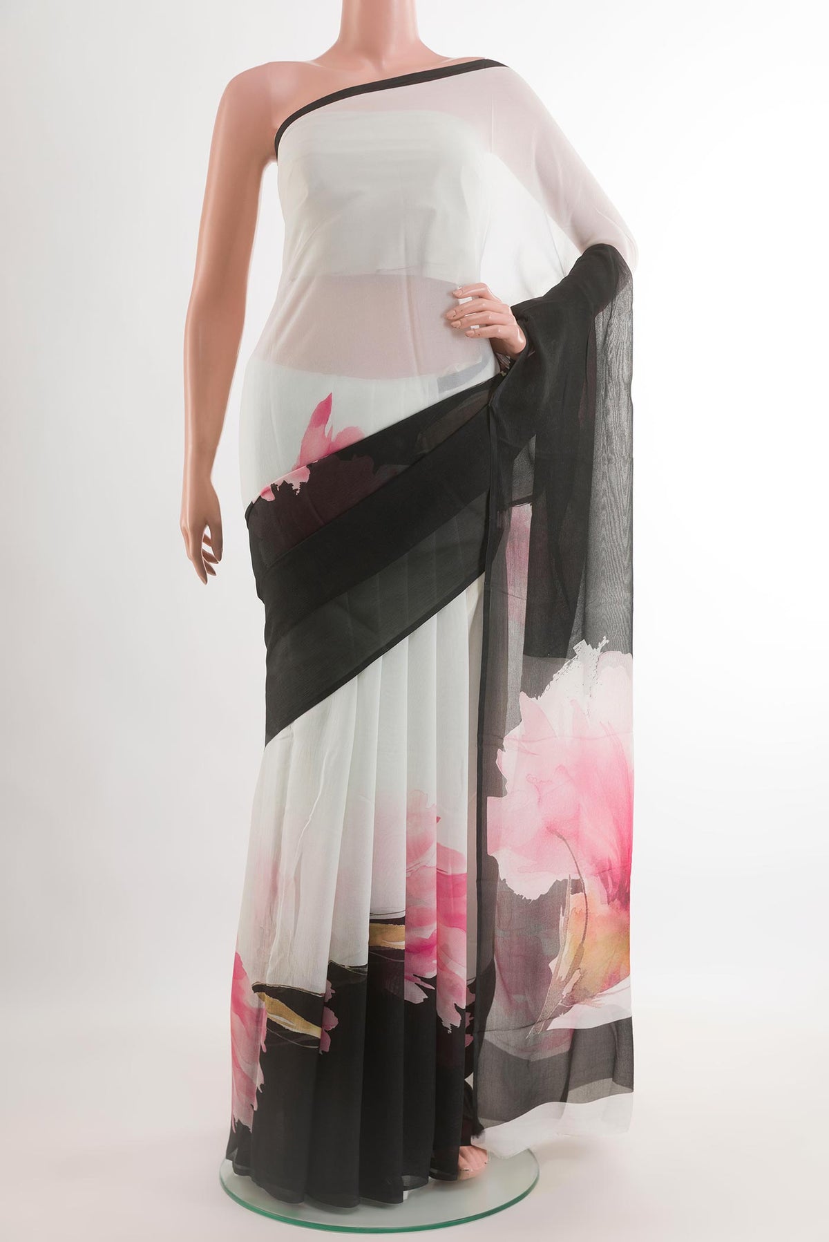 Black Chiffon Saree with Printed design on the body and Zari Border.  displayed on a mannequin