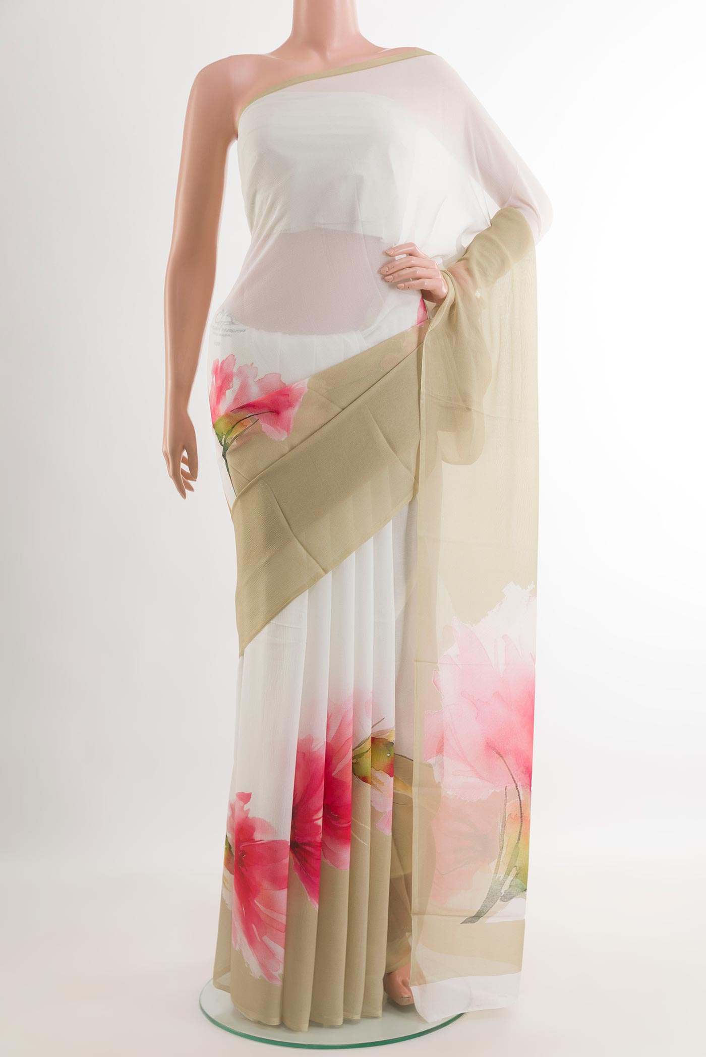 Beige Chiffon Saree with Printed design on the body and Zari Border.  displayed on a mannequin