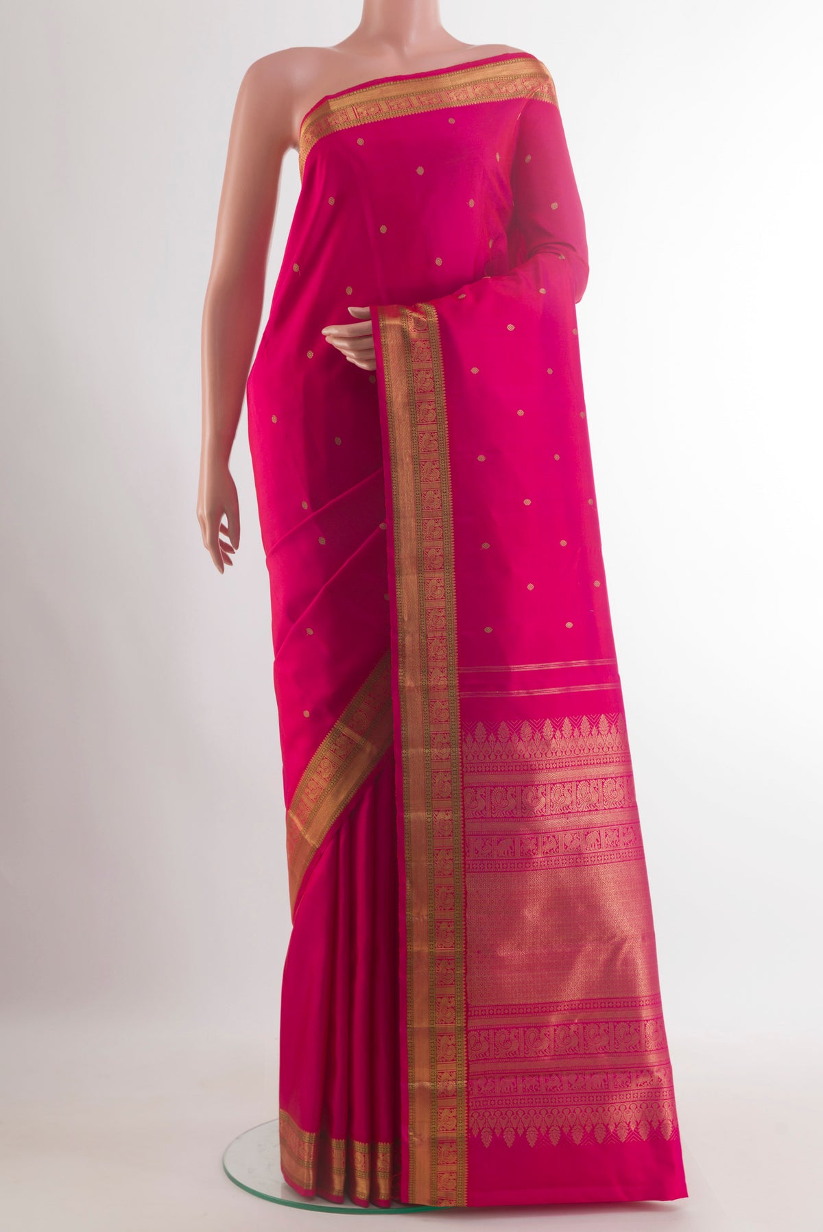 Pure Silk Pure Zari Pink Kanjivaram Saree with Zari Butta on the body and Zari Border.  displayed on a mannequin