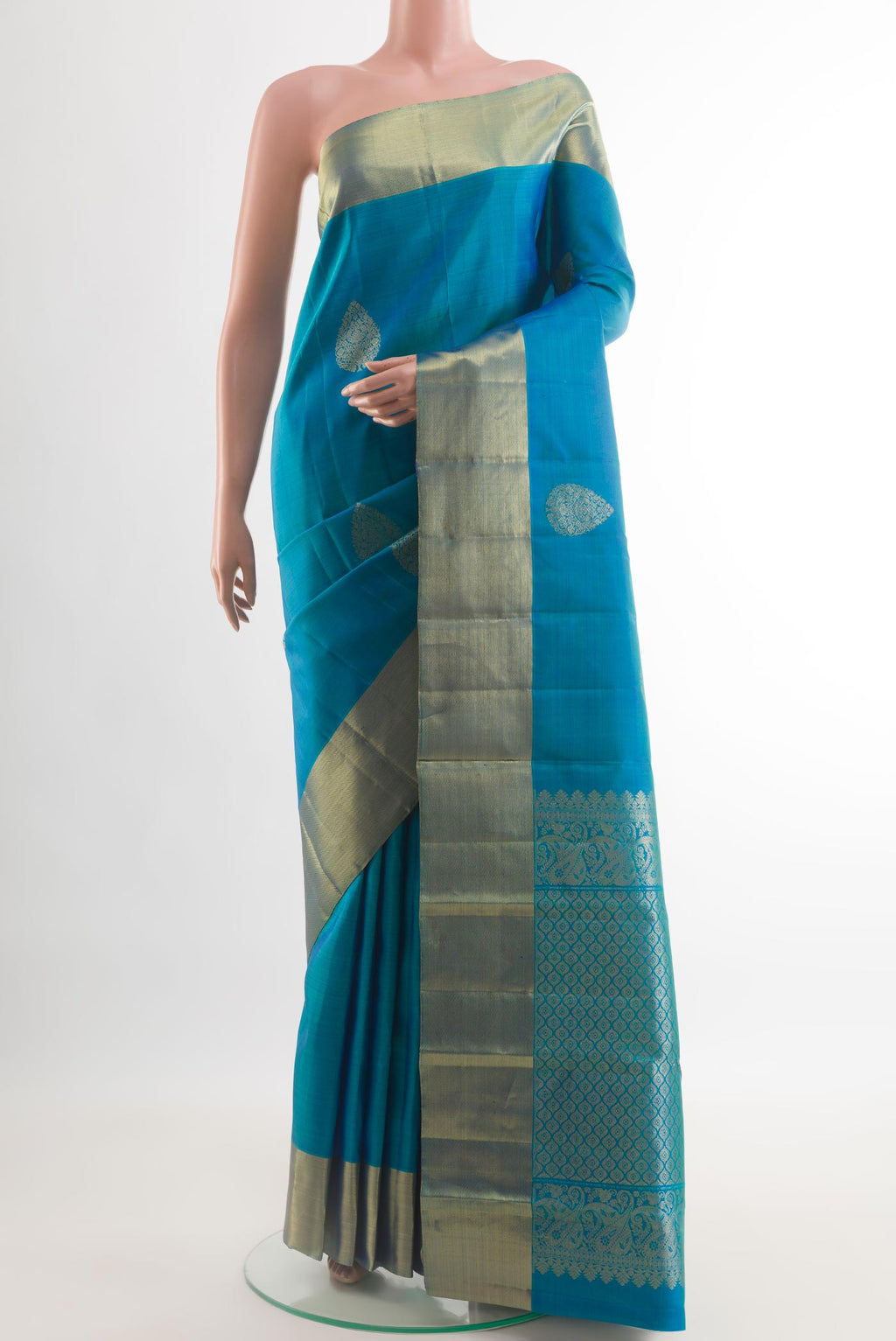 Blue Kanchipuram Silk Saree with Zari Butta on the body and Zari Border.  displayed on a mannequin
