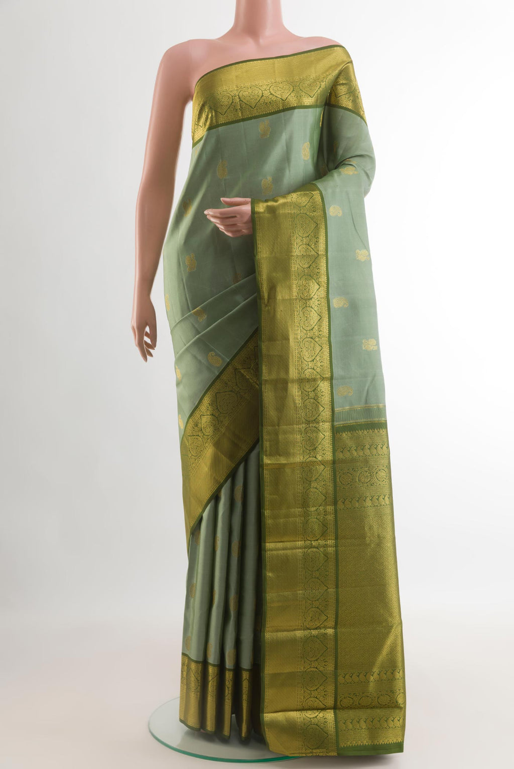 Grey Kanchipuram Silk Saree with Zari Butta on the body and Zari Border.  displayed on a mannequin