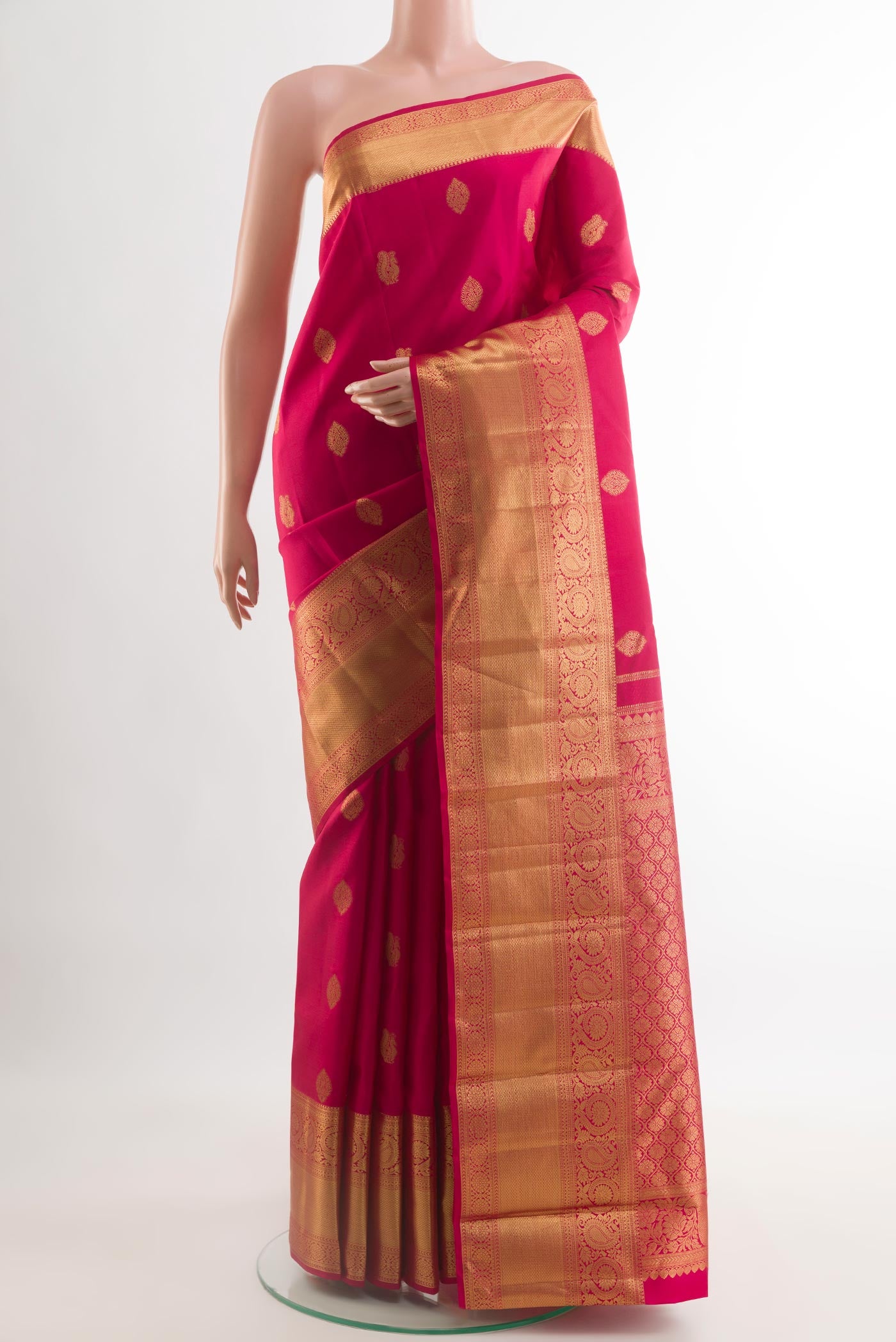 Red Kanchipuram Silk Saree with Zari Butta on the body and Zari Border.  displayed on a mannequin