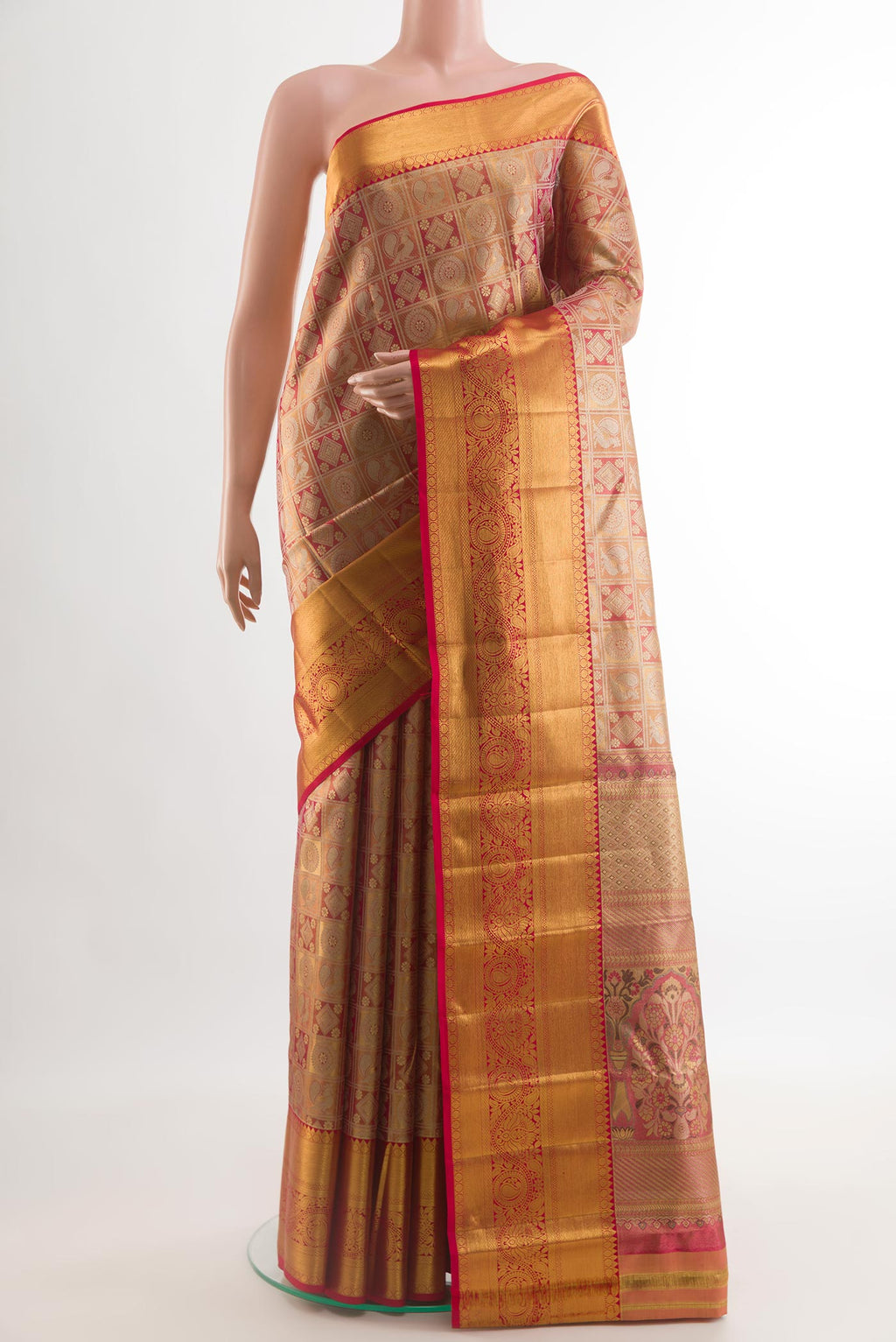 Peach Kanchipuram Silk Saree with Zari Brocade on the body and Zari Border.  displayed on a mannequin
