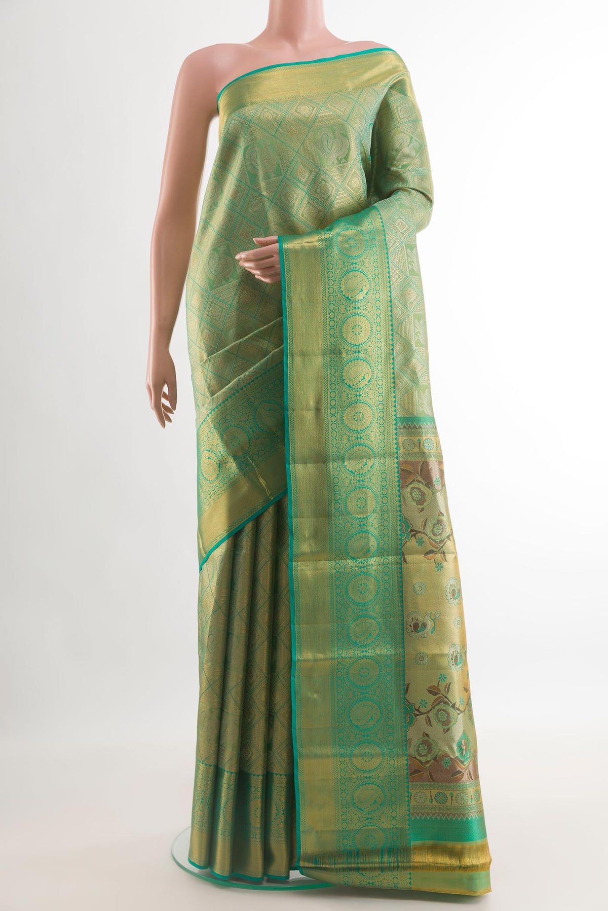 Sea Green Kanchipuram Silk Saree with Zari Brocade on the body and Zari Border.  displayed on a mannequin