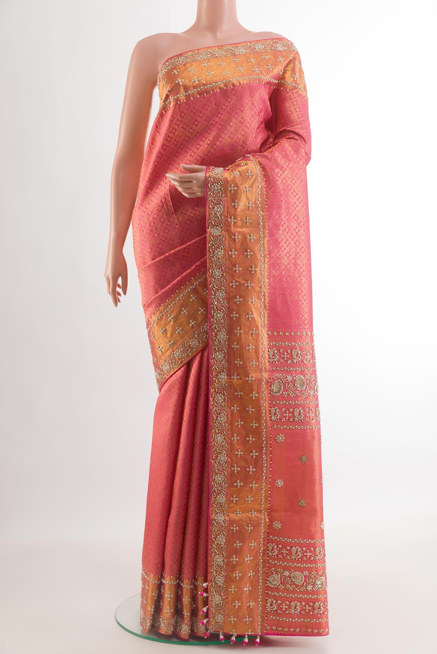 Pink Kanjivaram Silk Saree with Zari Brocade on the body and Zari Border.  displayed on a mannequin