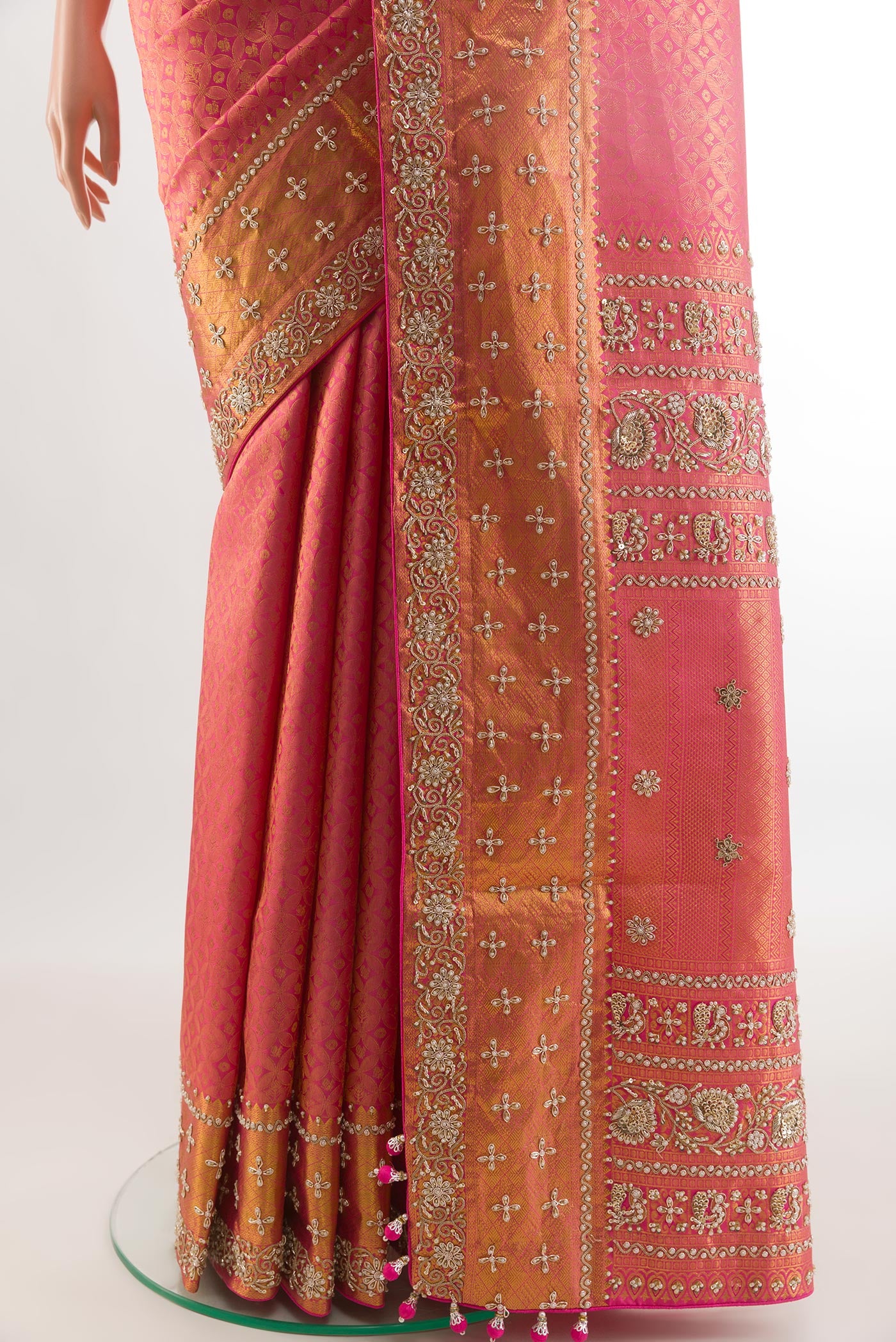 Pleats and pallu of Pink Kanjivaram Silk Saree with Zari Brocade on the body and Zari Border. 
