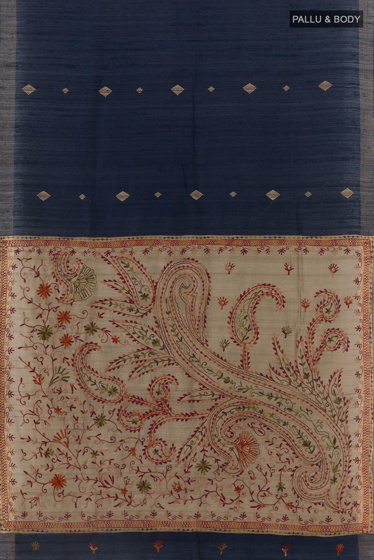 Flat view of Blue Tussar Silk Saree with Thread Butta on the body and Zari Border. 