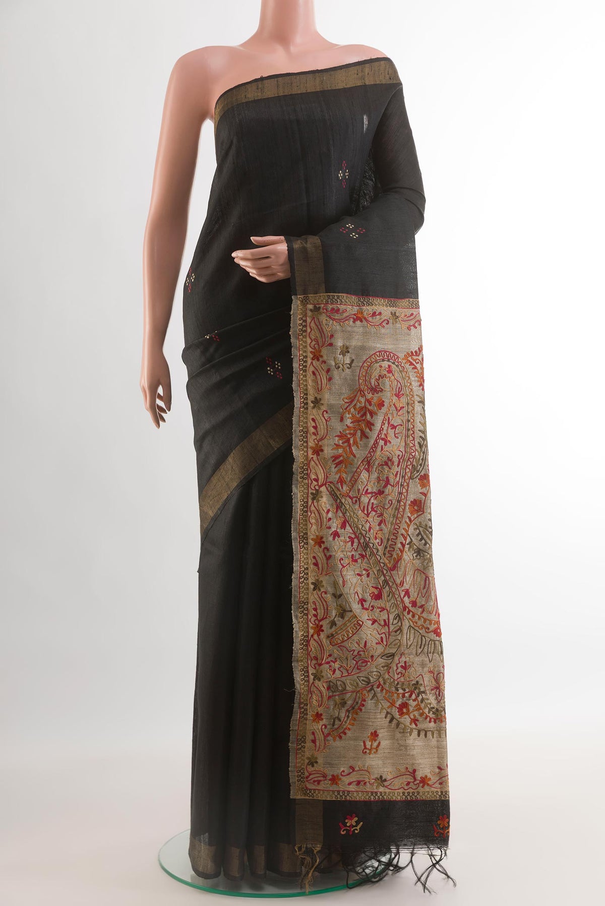 Black Tussar Silk Saree with Thread Butta on the body and Zari Border.  displayed on a mannequin