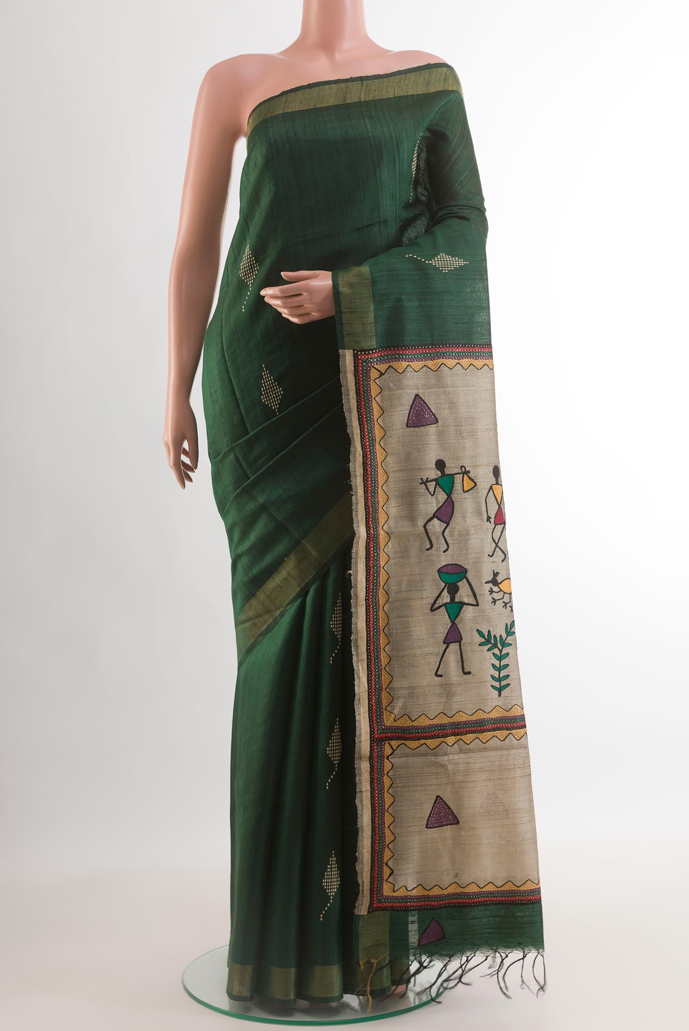 Bottle Green Tussar Silk Saree with Thread Butta on the body and Zari Border.  displayed on a mannequin
