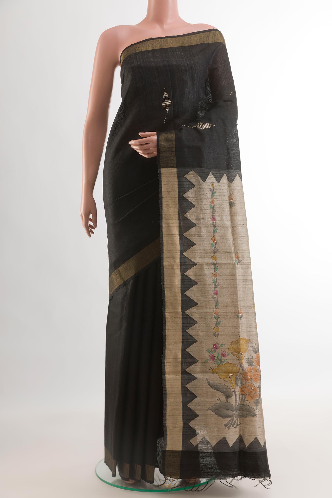 Black Tussar Silk Saree with Thread Butta on the body and Zari Border.  displayed on a mannequin