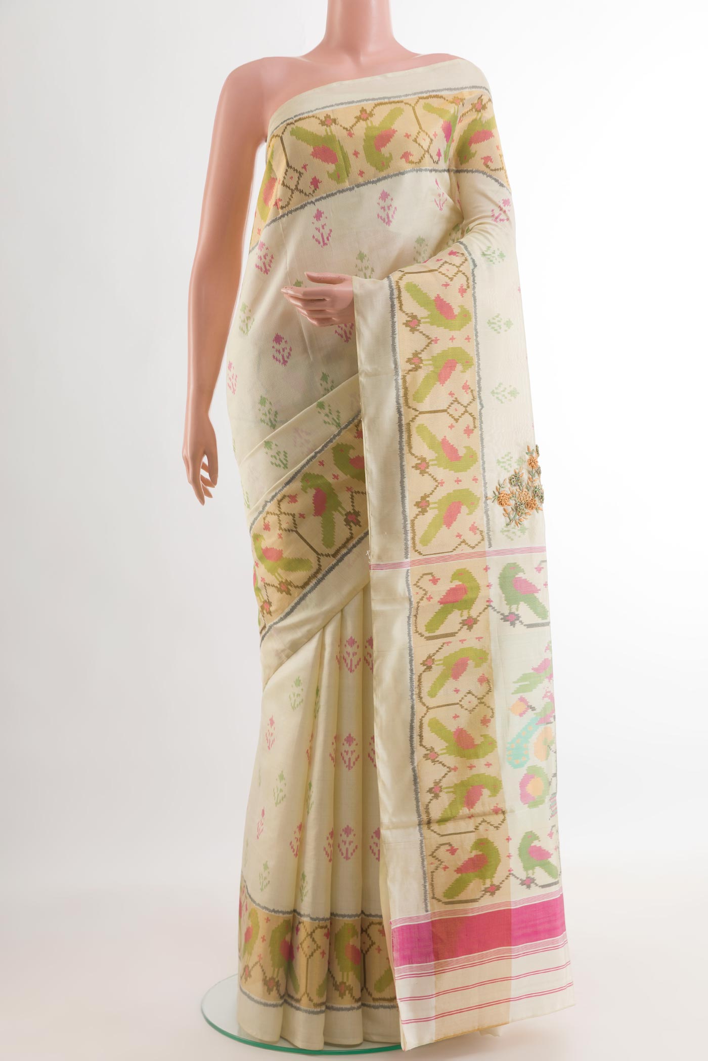 Cream Rajkot Patola Silk Saree with Pure Ikat on the body and Ikat Border.  displayed on a mannequin