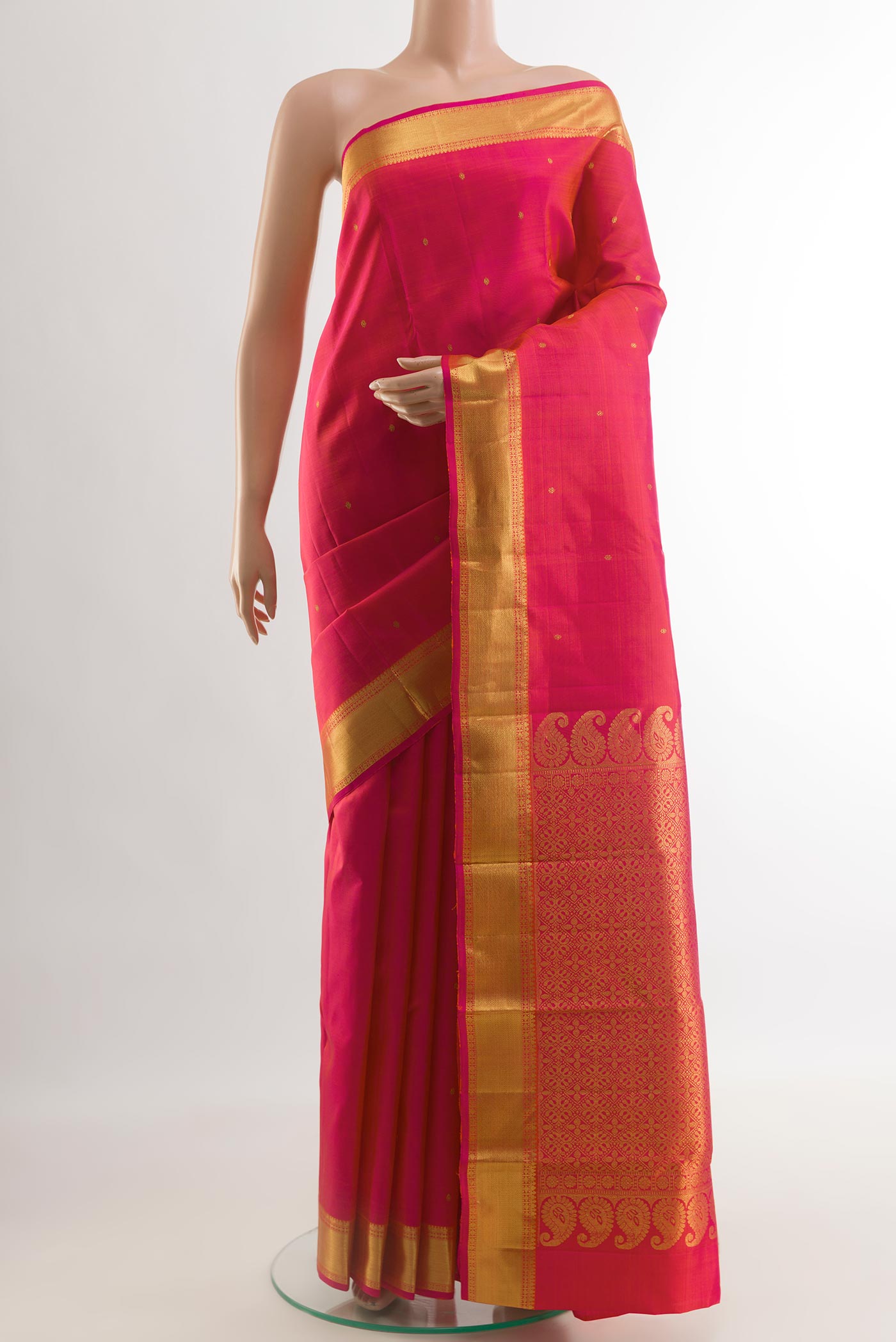 Pink Kanjivaram Silk Saree with Zari Butta on the body and Zari Border.  displayed on a mannequin