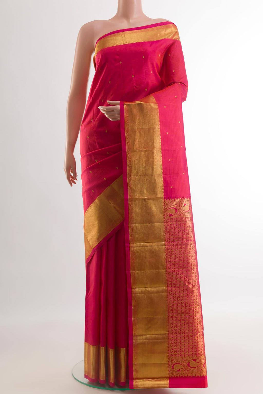 Pink Kanchipuram Silk Saree with Zari Butta on the body and Zari Border.  displayed on a mannequin