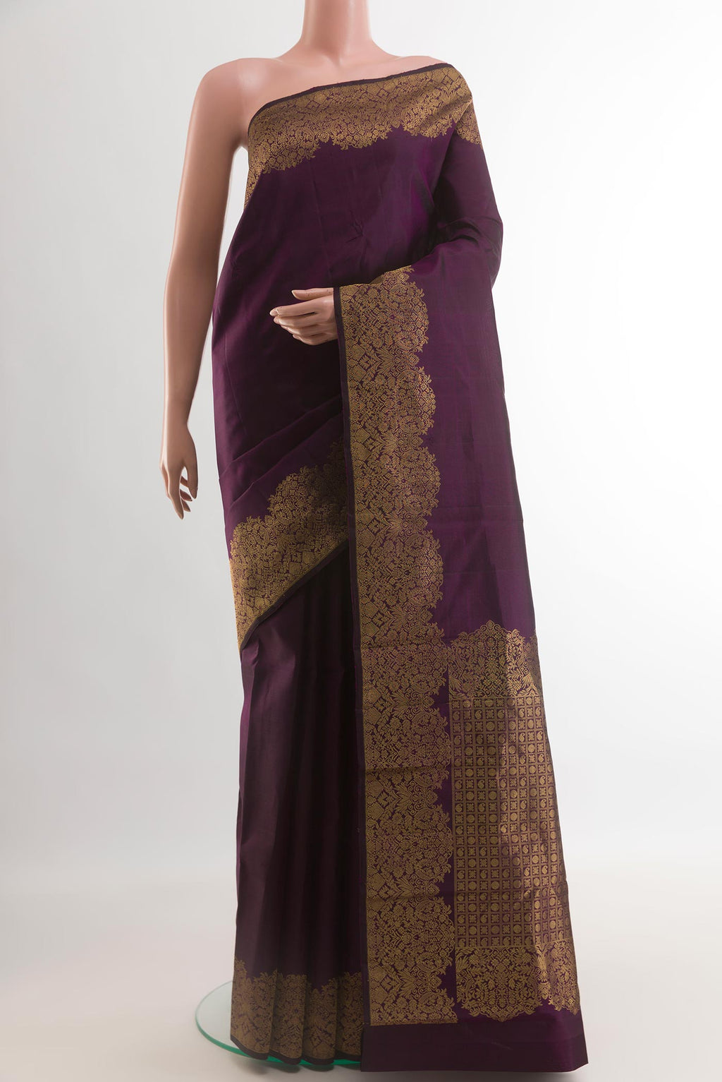Purple Kanchipuram Silk Saree with Plain Body and Zari Border.  displayed on a mannequin