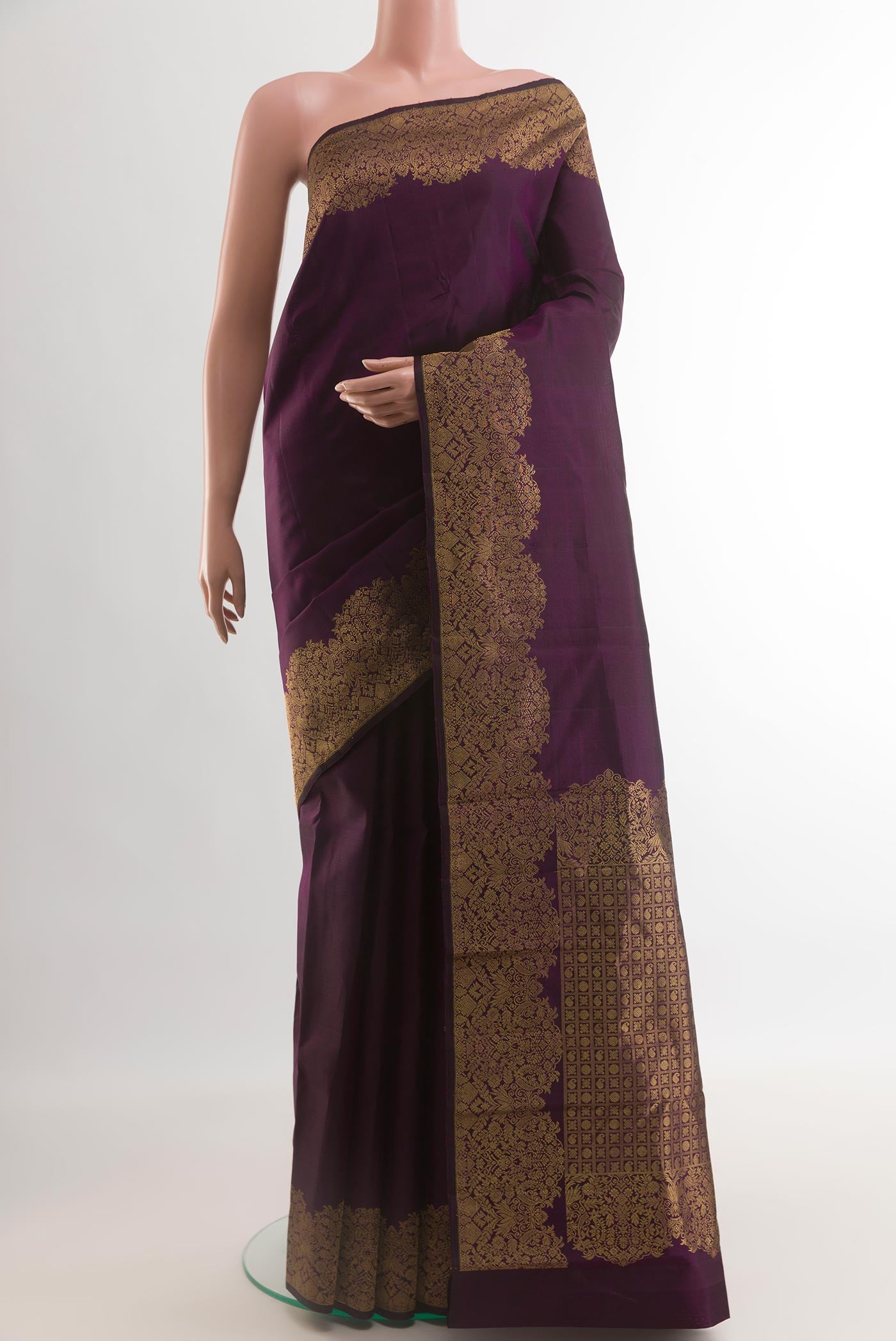 Purple Kanchipuram Silk Saree with Plain Body and Zari Border.  displayed on a mannequin