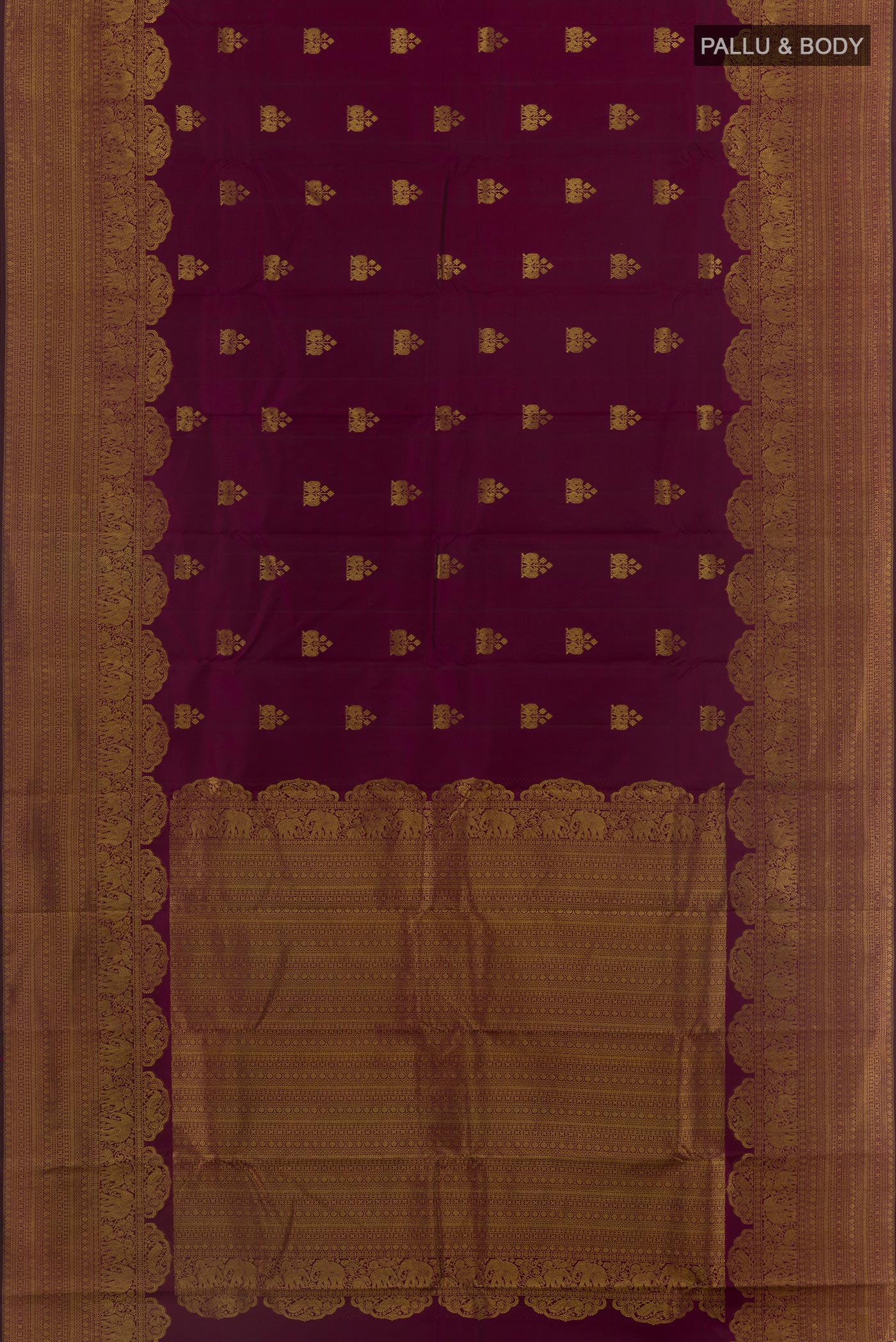Flat view of Purple Kanchipuram Silk Saree with Zari Butta on the body and Zari Border. 