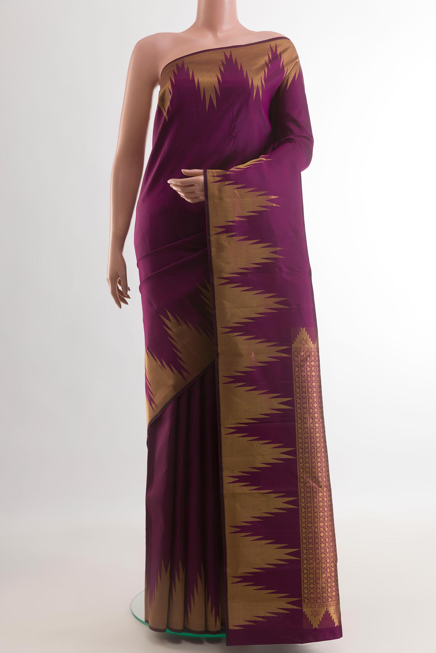 Purple Kanchipuram Silk Saree with Plain Body and Temple Border.  displayed on a mannequin