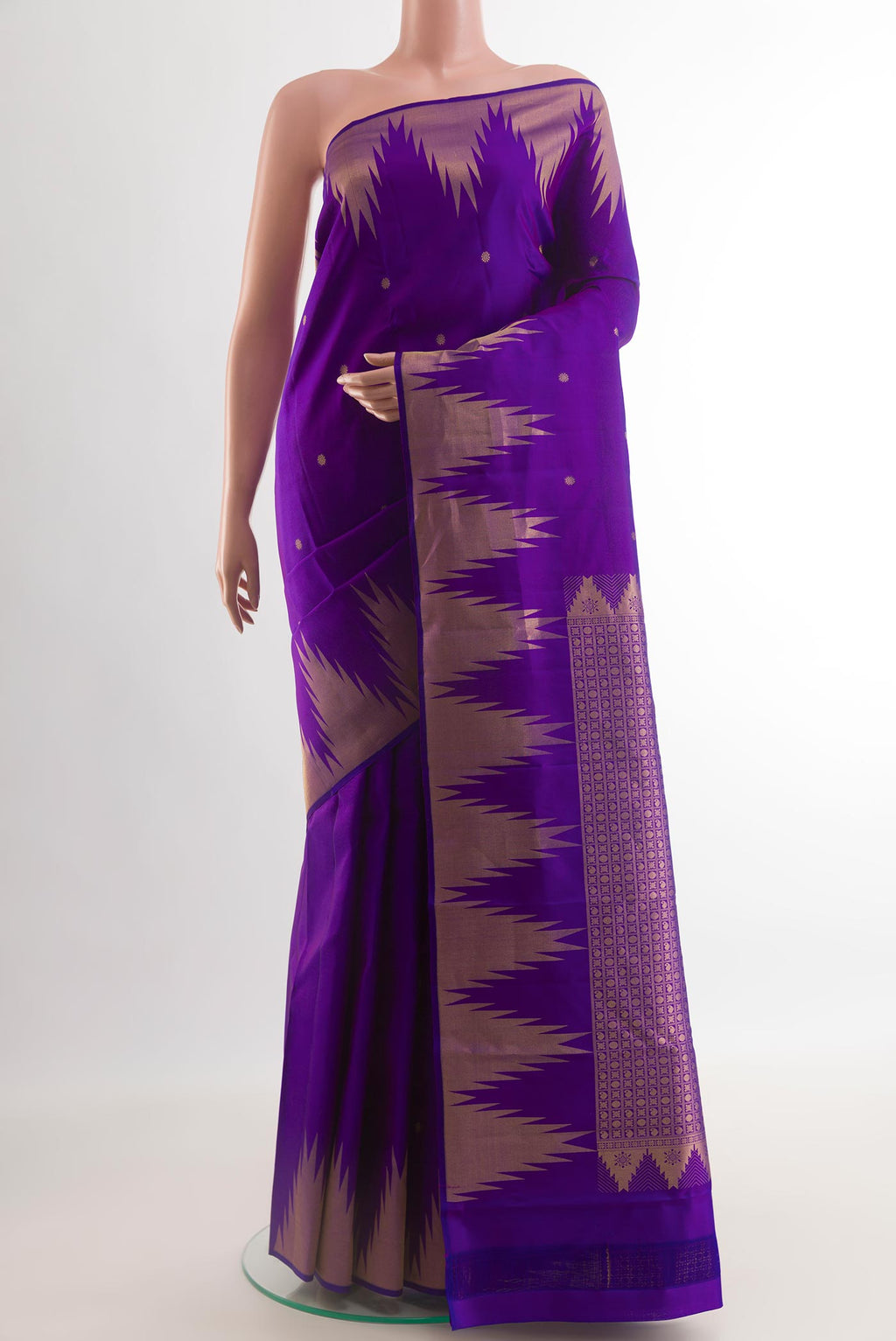 Violet Kanchipuram Silk Saree with Zari Butta on the body and Temple Border.  displayed on a mannequin