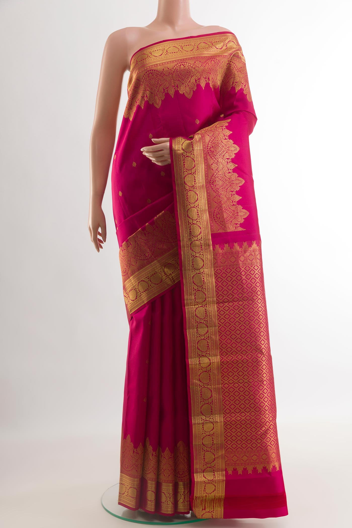 Pink Kanchipuram Silk Saree with Zari Butta on the body and Zari Border.  displayed on a mannequin
