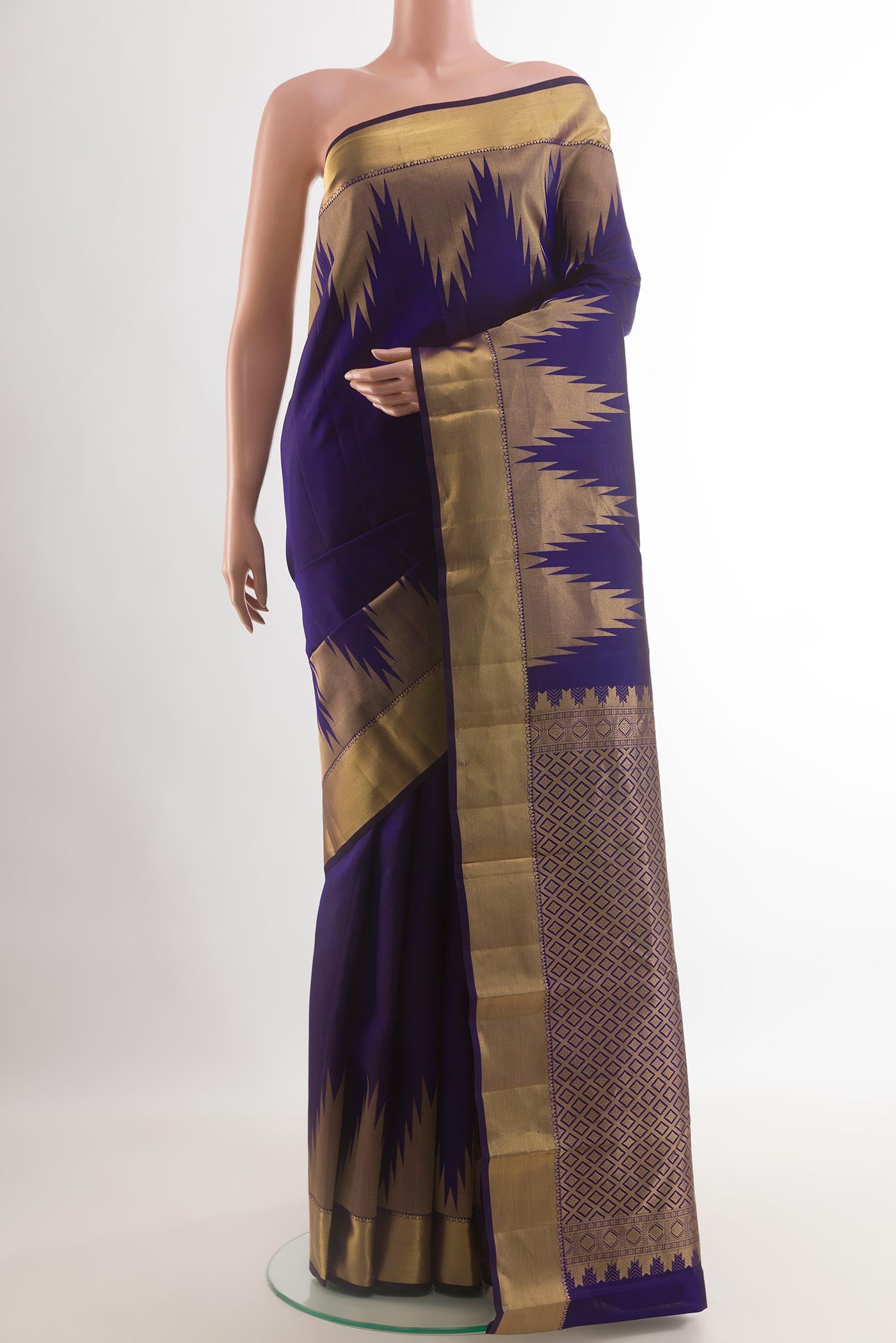 Navy Blue Kanchipuram Silk Saree with Plain Body and Temple Border.  displayed on a mannequin