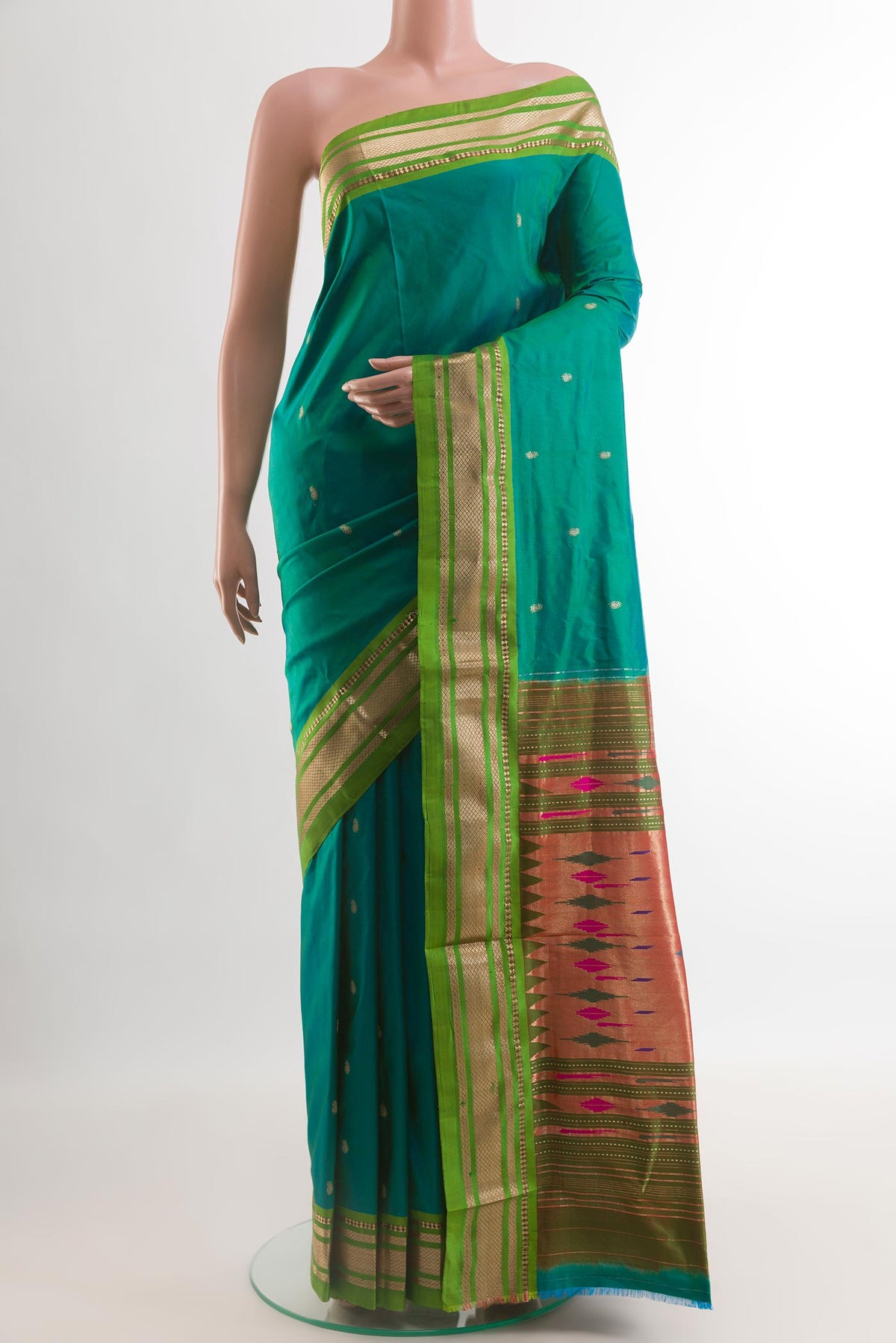 Peacock Blue Paithani Silk Saree with Zari Butta on the body and Zari Border.  displayed on a mannequin