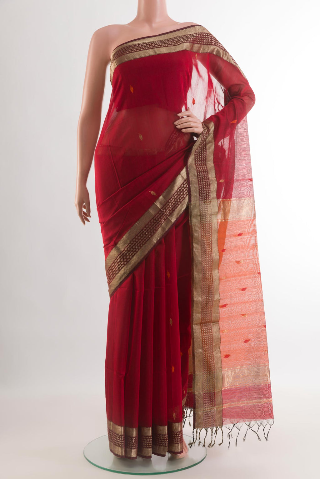 Red Blended Maheshwari Silk Cotton Saree with Thread Butta on the body and Zari Border.  displayed on a mannequin